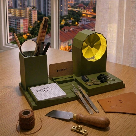 Green desk organizer with stationery items on a wooden desk with a cityscape view.